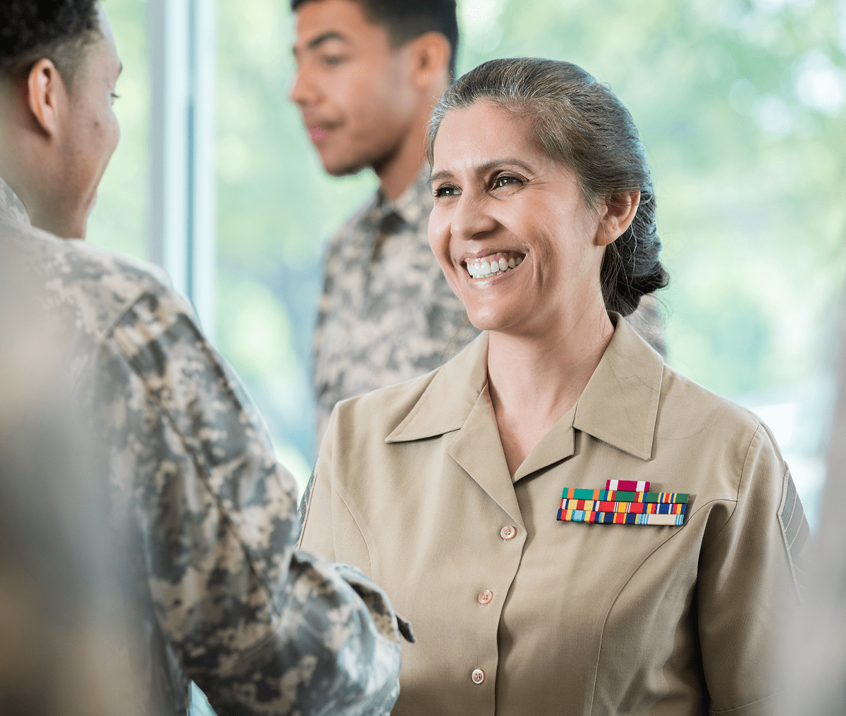 Female officer greeting colleagues